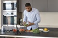 Handsome young Black cock blogger man recording healthy eating masterclass