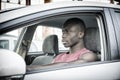 Handsome Young Black Man Driving a Car Royalty Free Stock Photo