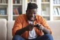 Handsome young black man playing video games at home Royalty Free Stock Photo