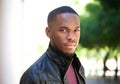 Handsome young black man posing outside Royalty Free Stock Photo