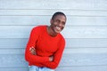 Handsome young black man smiling with arms crossed Royalty Free Stock Photo