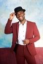 Handsome young black man smiling with hat and vintage suit Royalty Free Stock Photo