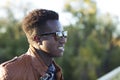 Handsome young black man in sunglasses and a leather jacket on a Royalty Free Stock Photo