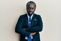 Handsome young black man wearing business suit and tie skeptic and nervous, disapproving expression on face with crossed arms Royalty Free Stock Photo