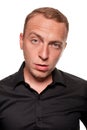 Handsome young blond man in a black shirt, isolated on a white background Royalty Free Stock Photo