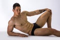 Handsome young bodybuilder laying down on floor Royalty Free Stock Photo