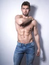 Handsome young bodybuilder with toned body Royalty Free Stock Photo