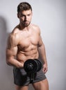 Handsome young bodybuilder with toned body Royalty Free Stock Photo