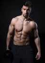 Handsome young bodybuilder with toned body Royalty Free Stock Photo