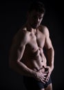 Handsome young bodybuilder with toned body Royalty Free Stock Photo