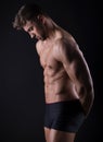 Handsome young bodybuilder with toned body Royalty Free Stock Photo