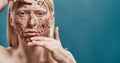 Handsome young boy peeling his face with scrub Royalty Free Stock Photo