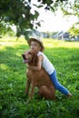 Handsome Young Boy Playing with His Dog at the park Royalty Free Stock Photo