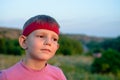 Handsome young boy staring into the distance Royalty Free Stock Photo