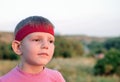 Handsome young boy staring into the distance Royalty Free Stock Photo