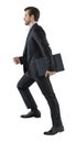 Young business man go walk making step  businessman wear elegant black suit and and holding a laptop or folder. isolated over Royalty Free Stock Photo