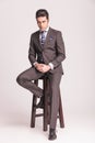 Handsome young business man sitting on a chair Royalty Free Stock Photo