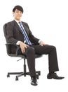 Handsome Young business man sitting on a chair Royalty Free Stock Photo