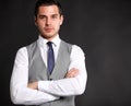 Handsome young business man standing on black Royalty Free Stock Photo