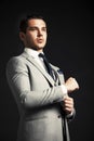 Handsome young business man standing on black Royalty Free Stock Photo