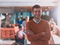 Handsome young business man standing confident in the office in front of his team Royalty Free Stock Photo