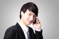 Handsome young business man using cell phone Royalty Free Stock Photo