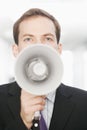 Handsome Young Businessman With Bullhorn