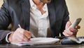 Handsome young businessman at desk on phone Royalty Free Stock Photo