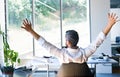 Businessman at the desk in his office stretching arms. Royalty Free Stock Photo