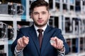 handsome young businessman holding bitcoins at cryptocurrency