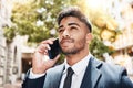 Ive got big plans. a handsome young businessman making a phonecall while out in the city. Royalty Free Stock Photo