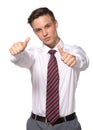 Handsome young businessman shows thumbs gesture on white