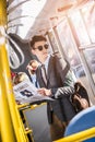 handsome young businessman in sunglasses reading newspaper Royalty Free Stock Photo