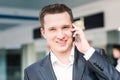 Handsome young businessman talking on his mobile Royalty Free Stock Photo