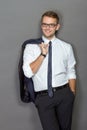 A handsome young businessman wearing glasses and smiling. Vertic Royalty Free Stock Photo