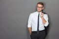 A handsome young businessman wearing glasses. Vertical shot. Royalty Free Stock Photo