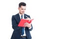 Handsome young businessman writing notes on a notebook Royalty Free Stock Photo