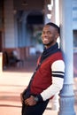 Handsome young casual man laughing in the city Royalty Free Stock Photo