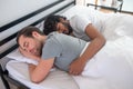 Romantic gay couple dozing in their bedroom