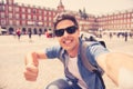 Handsome young caucasian tourist man happy and excited taking a selfie in Plaza Mayor, Madrid Spain Royalty Free Stock Photo