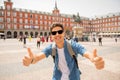 Handsome young caucasian tourist man happy and excited taking a selfie in Plaza Mayor, Madrid Spain Royalty Free Stock Photo