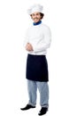 Handsome young cook posing in uniform