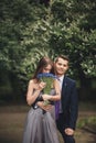 Handsome young couple posing outdoors after ceremony Royalty Free Stock Photo