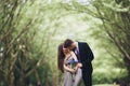 Handsome young couple posing outdoors after ceremony Royalty Free Stock Photo