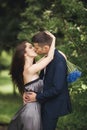 Handsome young couple posing outdoors after ceremony Royalty Free Stock Photo