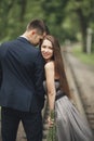 Handsome young couple posing outdoors after ceremony Royalty Free Stock Photo