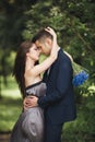 Handsome young couple posing outdoors after ceremony Royalty Free Stock Photo
