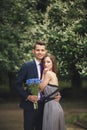 Handsome young couple posing outdoors after ceremony Royalty Free Stock Photo