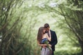 Handsome young couple posing outdoors after ceremony Royalty Free Stock Photo