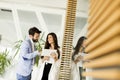 Handsome young couple with tablet in the modern office Royalty Free Stock Photo